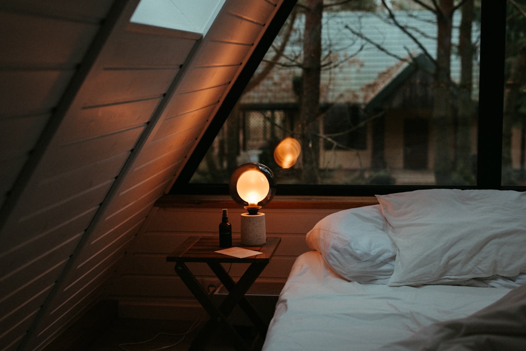 Cozy bedroom mood lighting beside a window