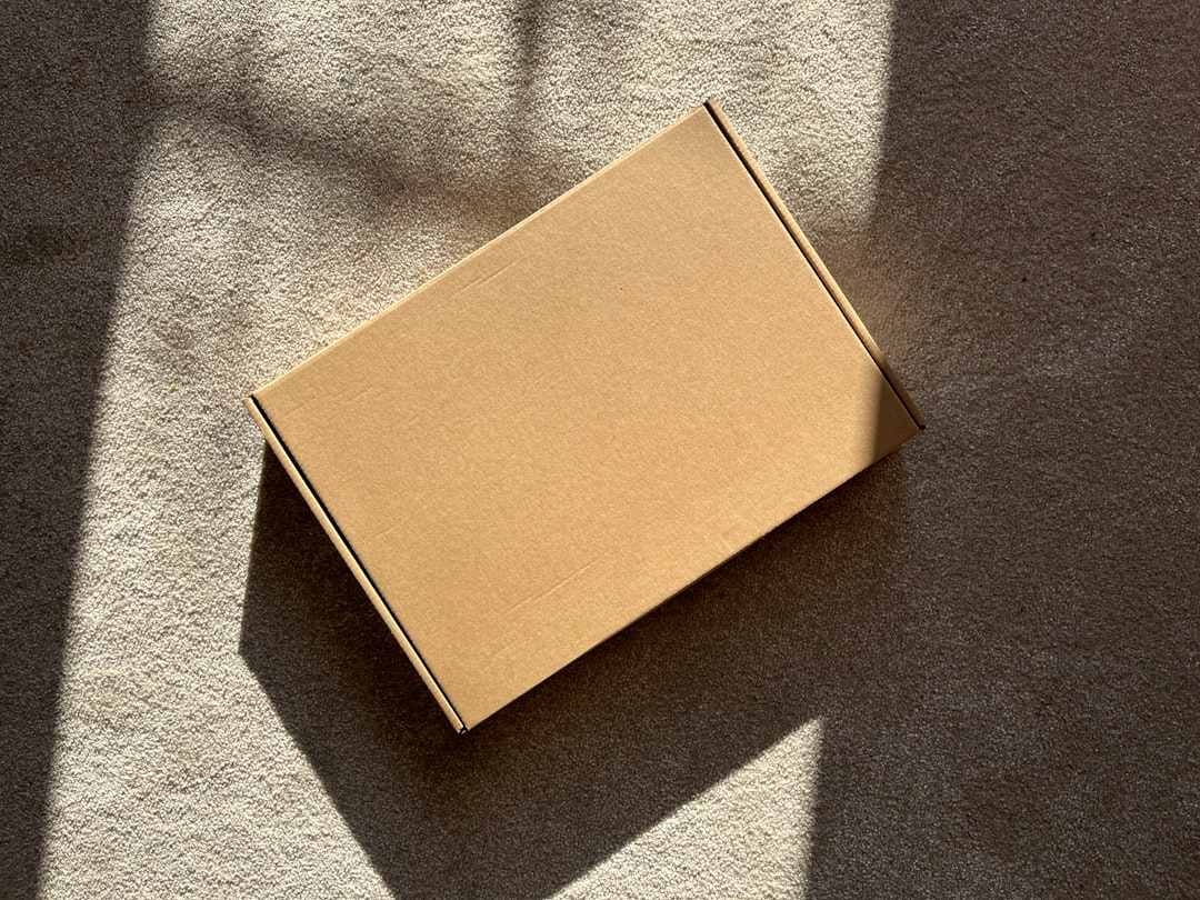 Honest reviews of trending AliExpress products — A cardboard box sits on a textured surface.