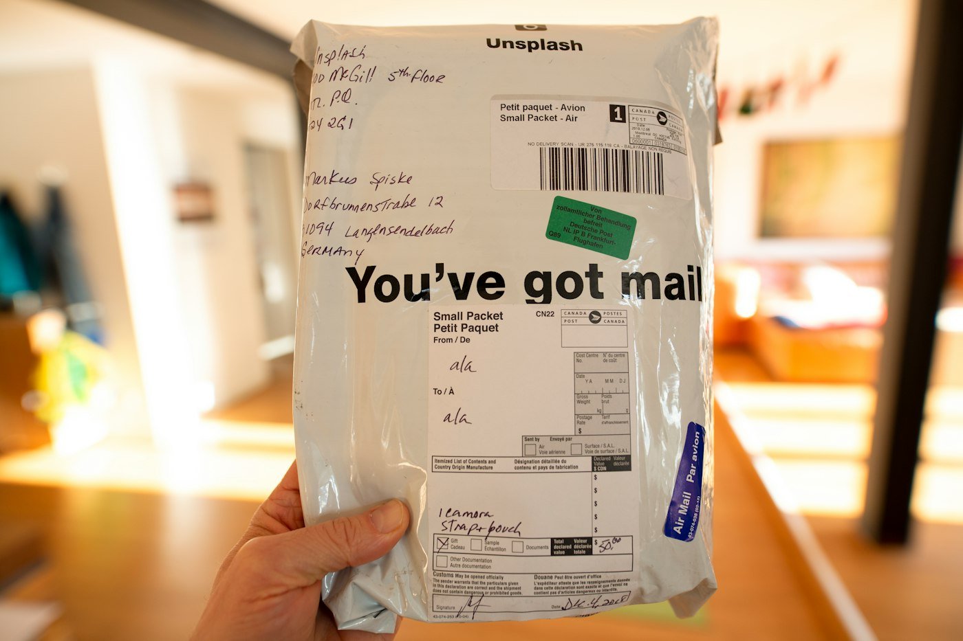 Courier handing a parcel to a customer at the door